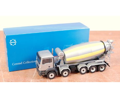 A Conrad 1:50 scale of a No. 71201 Liebherr Man TGS 41400 cement wagon comprising yellow and silver body housed in the origin