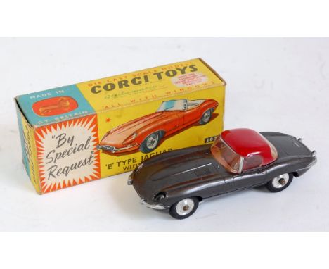 Corgi Toys, 307 Jaguar E type, metallic grey body with red removable hard top with brown interior and spun hubs, in the origi