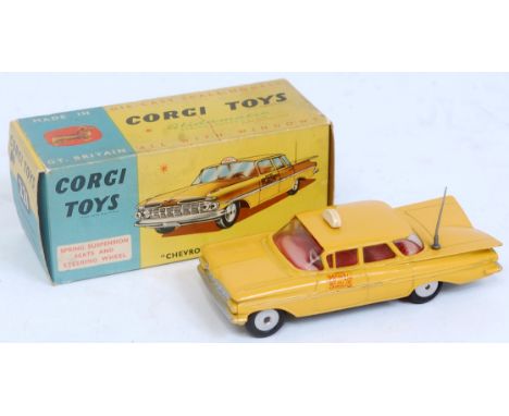 A Corgi Toys No. 221 Chevrolet New York taxi cab comprising of yellow body with red interior and spun hubs, sold in the origi