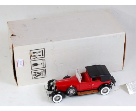 Three various boxed Franklin Mint 1:24 scale diecast saloons, to include a 1907 Rolls Royce Silver Ghost, a 1927 Rolls Royce 