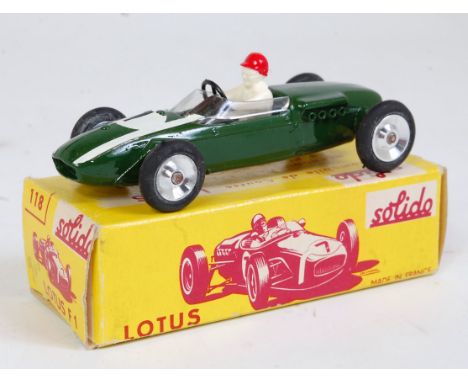A Solido No. 118 Lotus F1 racing car comprising green body with racing No. 1 and white racing stripes, in the original yellow