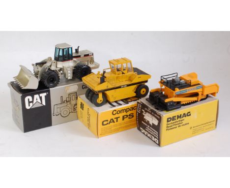 An NZG 1:50 scale boxed construction group to include No. 237 Caterpillar 966F wheel loader, No. 231 Demag road finisher, tog