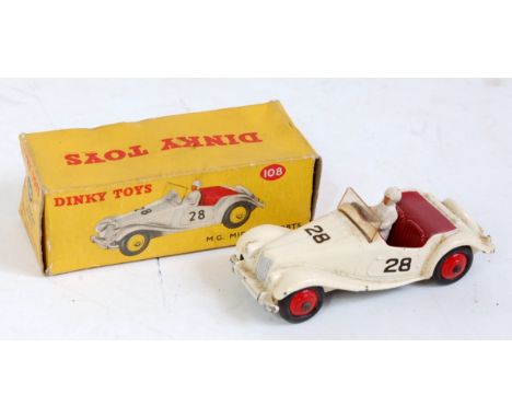 A Dinky Toys No. 108 MG Midget Sports comprising of light cream body with maroon interior and red hubs with driver figure, in