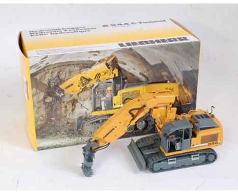 An NZG No. 808 1:50 scale model of a Liebherr R944C hydraulic tunnel excavator comprising of orange and grey body with shovel