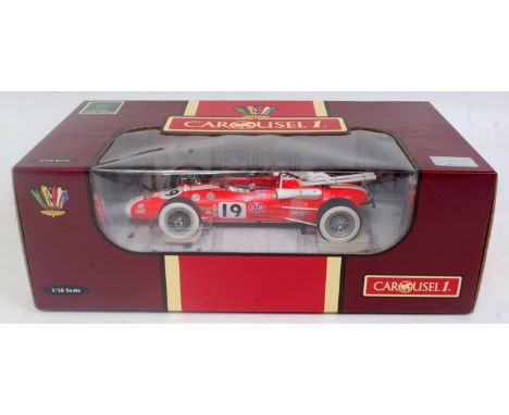 A Carousel 1 1:18 scale model of a Lotus 38 1966 Indie 500 racing car, comprising of racing No. 19 with Gasoline Treatment li