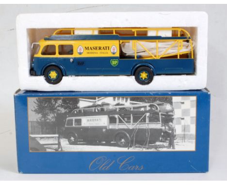 A 1:43 scale Maserati car transporter, comprising dark blue and yellow Fiat Transporter body with Maserati livery, appears as