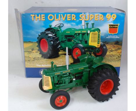 A Franklin Mint Precision Models 1:12 scale model of The Oliver Super 99 diesel tractor comprising green and yellow body with