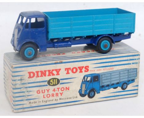 A Dinky Toys No. 511 guy 4-ton lorry, comprising dark blue cab and chassis with light blue back and light blue hubs, sold in 