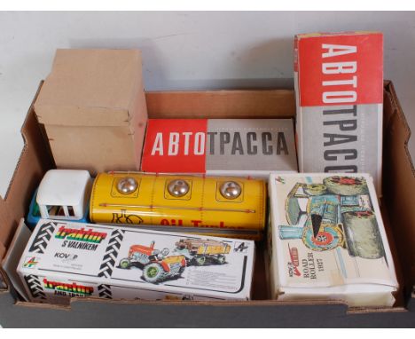 One box containing six various boxed and loose tinplate items to include a Kovap tractor and trailer, Kovap tinplate 1927 rol