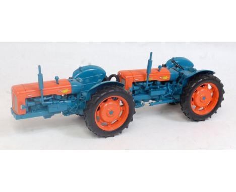 A Universal Hobbies 1:16 scale box model of a Fordson Doe Triple D tractor, comprising blue and orange body with orange hubs,