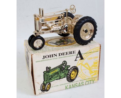 An ERTL 1:16 scale boxed gold John Deere Model A Tractor, 125th Anniversary Kansas City release example, in the original all-