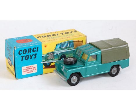 A Corgi Toys No. 438 Land Rover 109 WB comprising metallic green body with green canopy and wire work cast hubs, in the origi