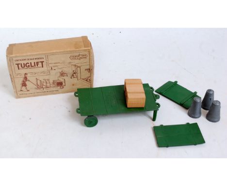 A Crescent scale models No. 1216 Tug lift set, comprising of green tug lift with two end sections, wooden crate and three chu