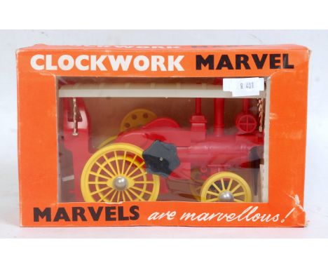 Triang Minic No.252 Plastic and Clockwork Traction Engine, finished in red, white and yellow, in the original window box (M-B