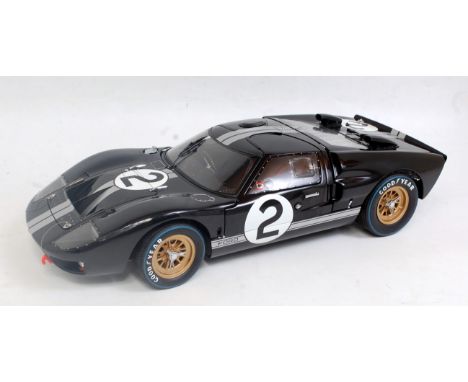 An Exoto 1:10 scale model of a 1966 Ford GT 40 Mk2, finished in black with racing No. 2 and silver racing stripes with gold h