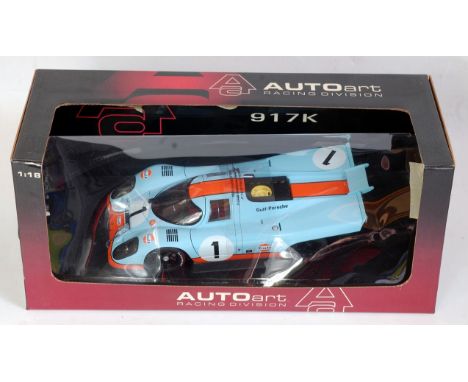 An Auto Art Racing Division 1:18 scale model of a Porsche 917K, model No. 80031 finished in light blue and orange with racing