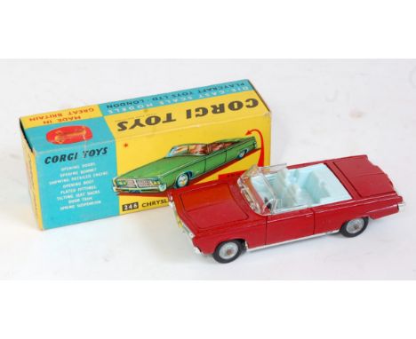 A Corgi Toys No. 246 Chrysler Imperial comprising red body with light blue interior and missing figures, with golf trolley in