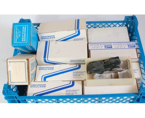 One tray containing a quantity of various 1/43 scale white metal and resin plastic car kits, spare parts, and accessories, so