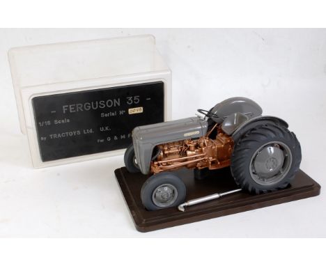 A Tractoys Ltd 4 G&amp;M farm models 1:16 scale resin and diecast model of a Ferguson 35 tractor comprising of grey and gold 