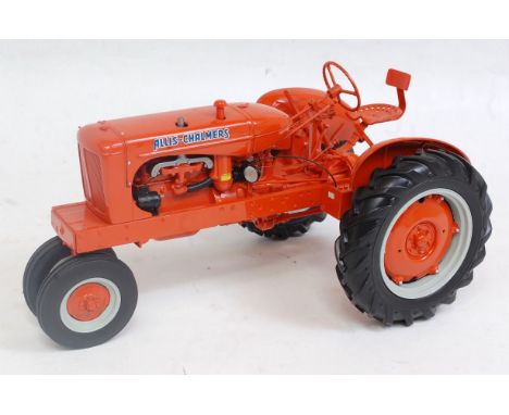 A Franklin Mint Precision models 1:12 scale model of an Alice Chalmers WC tractor comprising orange body with orange and grey