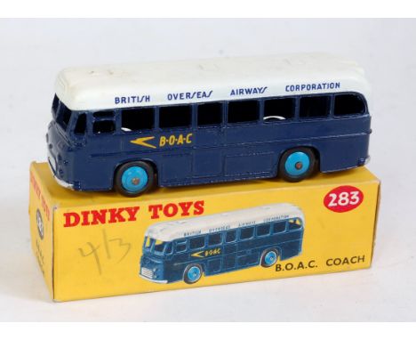 A Dinky Toys No. 283 BOAC coach comprising dark blue &amp; white body with light blue hubs, in the original all-card box (VG,