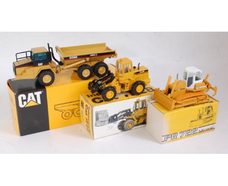 A Caterpillar Liebherr 1:50 scale boxed construction group to include an NZG No. 4131 Caterpillar D250E articulated truck, a 