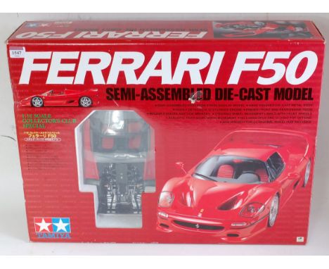 A Tamiya 1:12 scale collectors club special model of a semi assembled Ferrari F50 diecast racing car, appears as issued in th