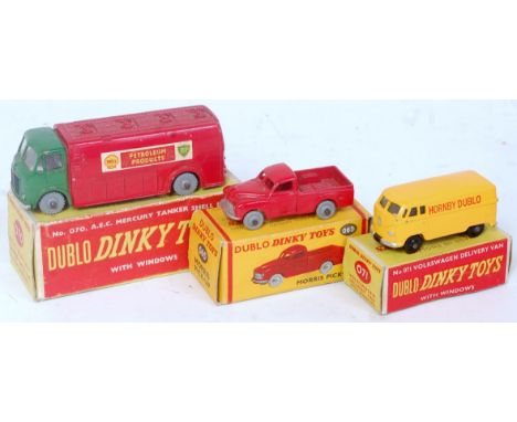 Three various boxed Dublo Dinky Toys to include 065 Morris pickup, 071 VW delivery van, and 070 Mercury BP tanker, all in ori