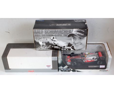 A 1:18 scale boxed Formula One racing diecast group to include a Quartzo Models No. Q9003 Lotus 49B Gold Leaf 1st Monaco Gran
