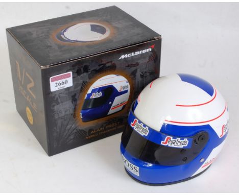 A KC Sports International 1:2 scale miniature replica Alain Prost World Champion 1985 F1 racing helmet, appears as issued