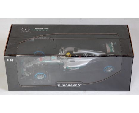 A Minichamps 1/18 scale model of a Mercedes AMG Petronas Motorsport F1 racing car, W07 Hybrid, Lewis Hamilton, winner Brazili