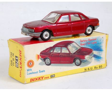 A Dinky Toys No. 176 NSU RO80 comprising metallic dark red body with cream interior and spun hubs with battery box compartmen