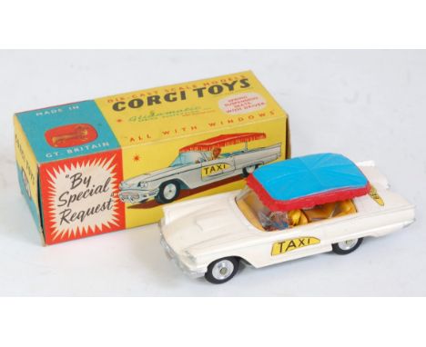 Corgi Toys, 430 Bermuda Taxi, white body with yellow interior, with driver figure, blue and red canopy, spun hubs, in the ori