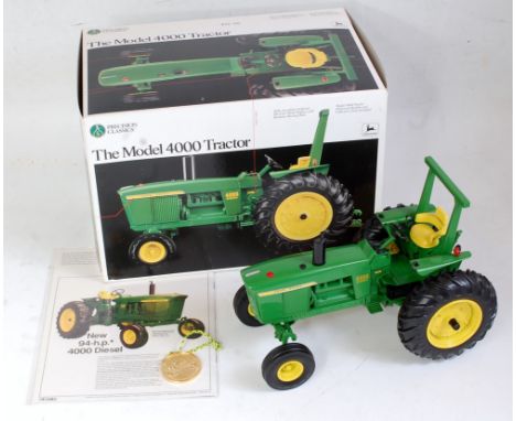 An Ertl Precision Classics 1:16 scale model of a John Deere 4000 tractor, model No. 5684 comprising yellow and green body wit