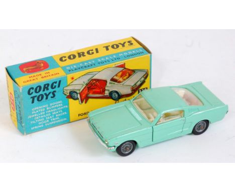 Corgi Toys 320, Ford Mustang Fastback 2+2, light green body, cream interior, jewelled headlights with spoked wheels, all card