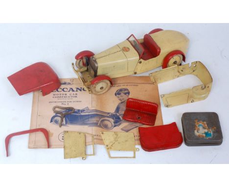 A Meccano No. 1 constructor's car comprising of cream and red body with cream hubs and Meccano transfer to bonnet, sold with 