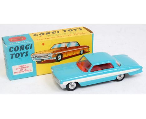 A Corgi Toys No. 235 Oldsmobile Super 88 saloon, comprising of light blue body with white stripe and red interior with spun h