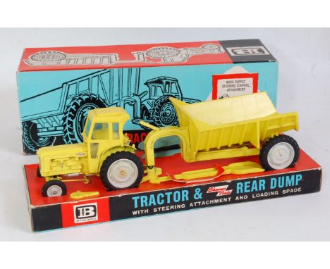 A Britains No. 9630 Fordson tractor and rear dump, rare yellow version with grey hubs, sold in the original lift-off lid all-