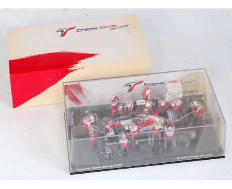 A Minichamps 1:43 scale Panasonic Toyota Racing F1 TF102 M Salo pit stop diorama, appears as issued in the original plastic c