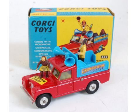 A Corgi Toys No. 487 Chipperfields Circus Land Rover parade vehicle, comprising red body with yellow interior and blue back, 