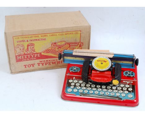 A Mettoy Mettype Junior tinplate working toy typewriter, sold in the original all-card box with leaflet