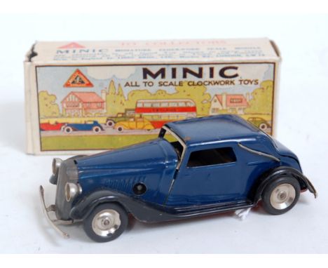 A Triang Minic tinplate and clockwork Vauxhall Cabriolet comprising dark blue and black body with spun hubs, in the original 