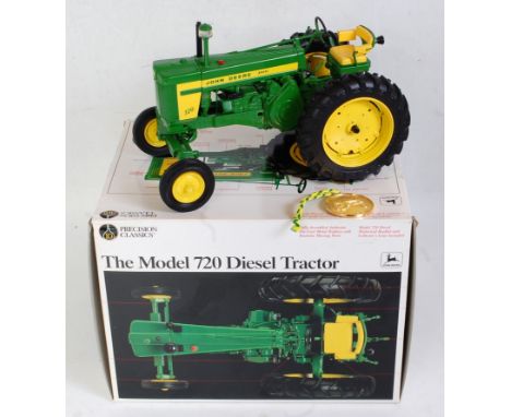 An Ertl Precision Classics 1:16 scale model of a John Deere Model 720 diesel tractor, model No. 5832 comprising green and yel