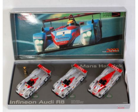 A Minichamps 1:43 scale limited edition Audi Sport Le Mans Hatrick 3 piece gift set, limited edition No. 0262/2002, all house