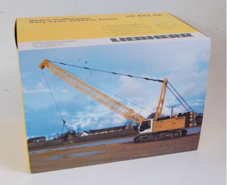 An NZG No. 728/02 1:50 scale model of a Liebherr HS855 HD ballast Needam Cranes, duty cycle crawler crane, comprising white a