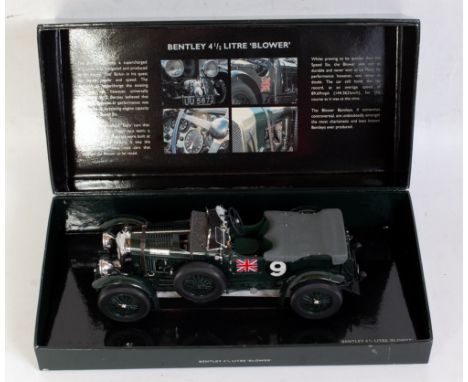 A Minichamps 1:18 scale model of a Bentley 4.5ltr Blower racing car finished in British Racing Green, housed in the original 