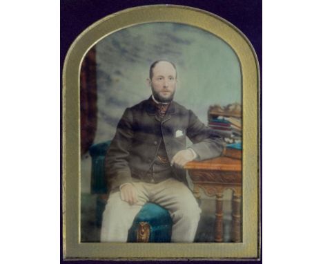 A PAIR OF VICTORIAN OVER PAINTED STUDIO PHOTOGRAPHS OF A SEATED LADY AND GENTLEMAN, ARCHED TOP, 19 X 14CM, GILT FRAMES AND AN