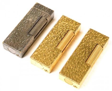 THREE DUPONT PLATED CIGARETTE LIGHTERS OF SIMILAR TEXTURED FORM, 1960'S 