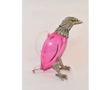 A novelty ruby glass decanter, with plated mounts, in the form of an eagle, 25 cm high 