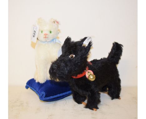 A Steiff limited edition Scotty Terrier, 273/3000, 402067, 14 cm high, and a Cat on a Pincushion, number 377, 420535, 19 cm h